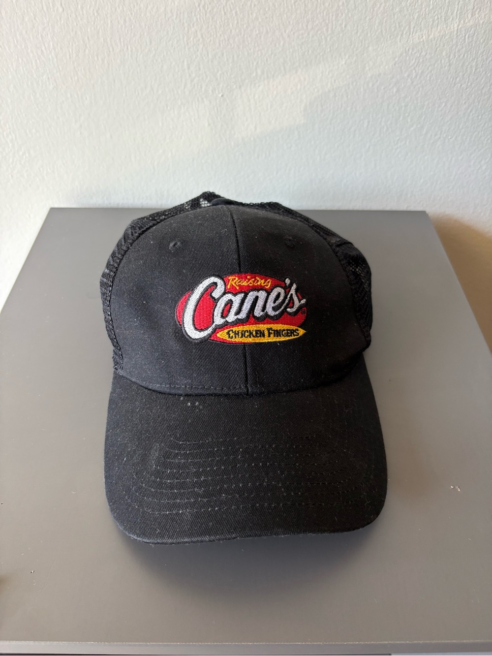 Raising Cane's Black Logo Trucker Hat
